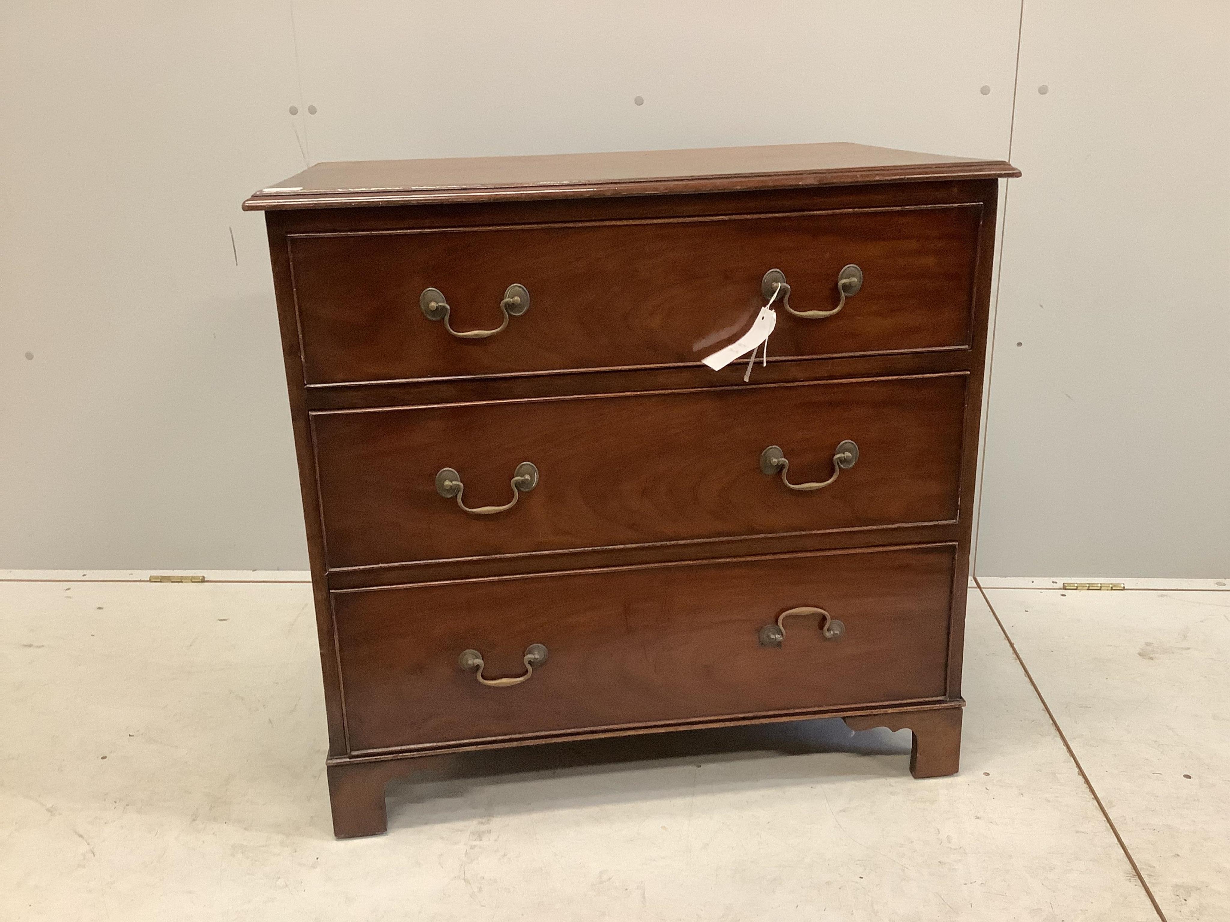 An early 20th century mahogany chest with a moulded top, three long drawers with brass loop handles and bracket feet, width 86cm, depth 56cm, height 82cm. Condition - fair to good